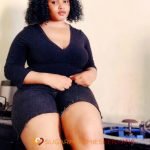 Portrait of Lilian, a sophisticated businesswoman from Malindi, Kenya, seeking a genuine connection with a younger partner. Join her on a journey of love, success, and adventure.