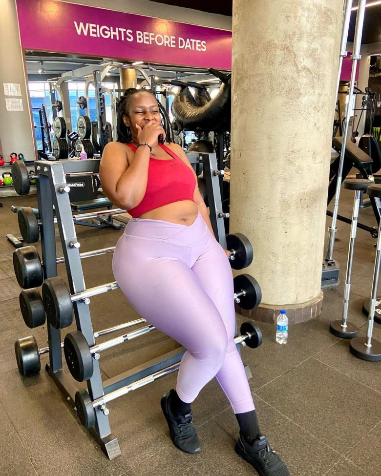 Zaweria, a confident 40-year-old Nairobi-based businesswoman and loving mother, smiling warmly in professional attire