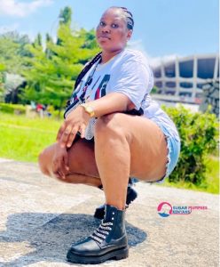 Beautiful Kisumu Sugar Mummy Viona smiling confidently in her apartment.